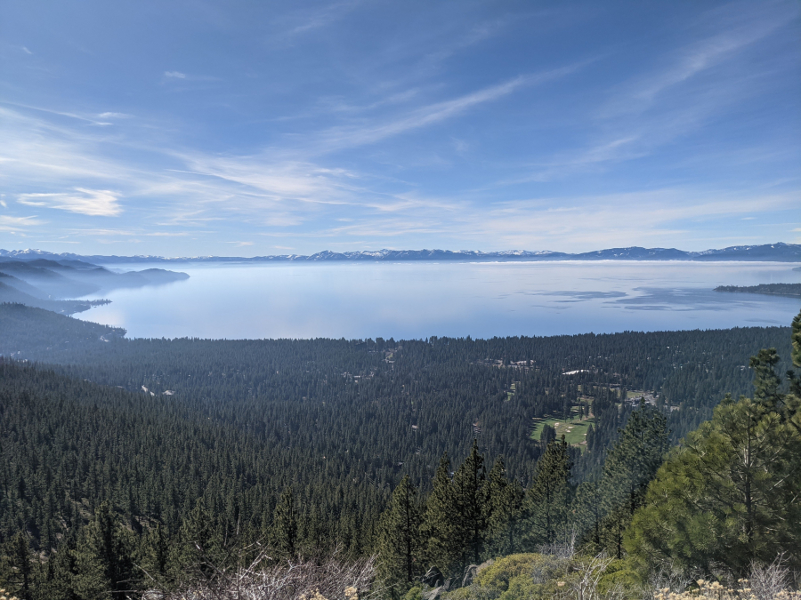 a view of Lake Tahoe from an overlook hill